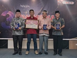 Pj Bupati Aceh Barat Terima Penghargaan HUT BIMCMEDIA